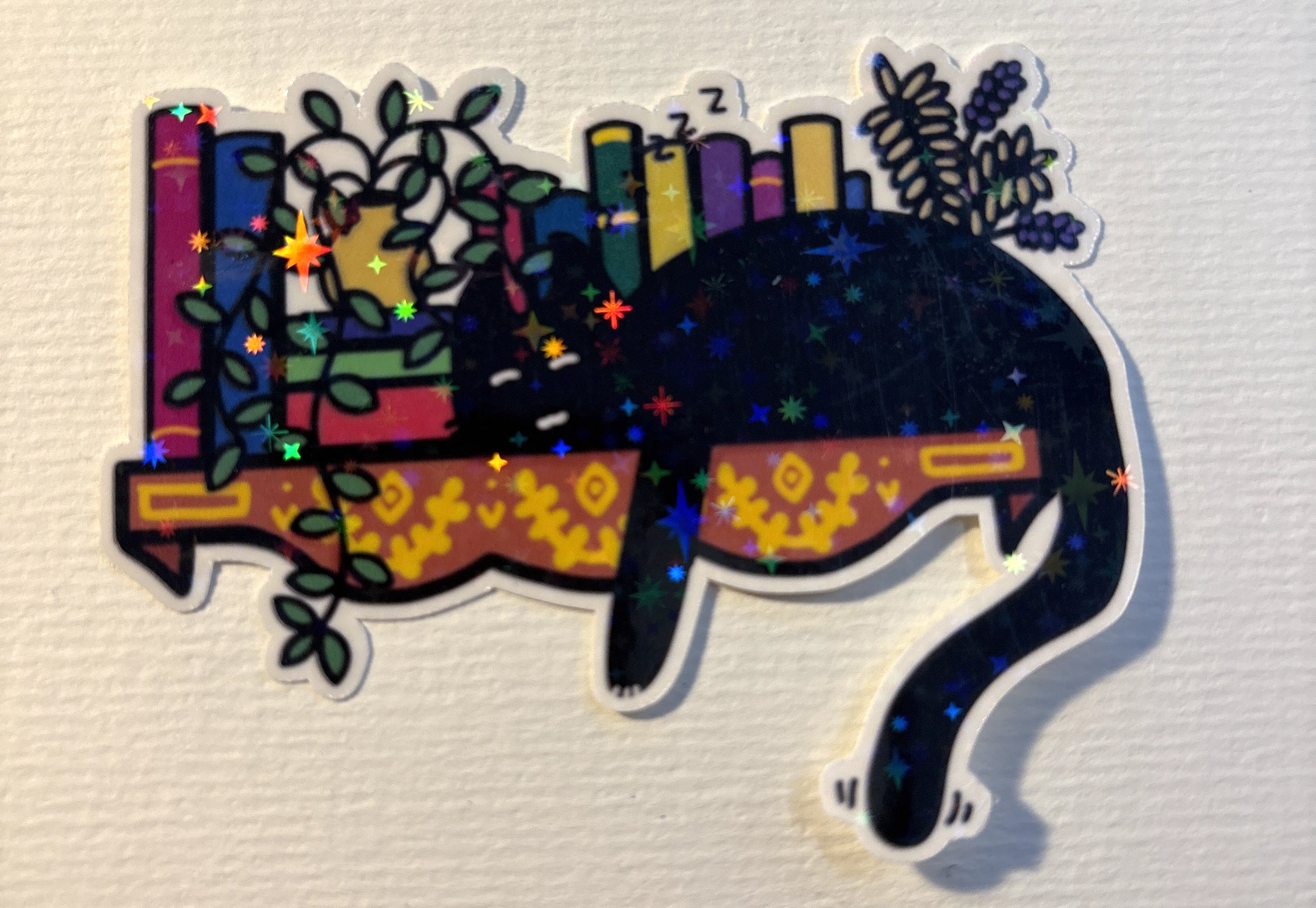 Sleepy Bookshelf Cat image 1