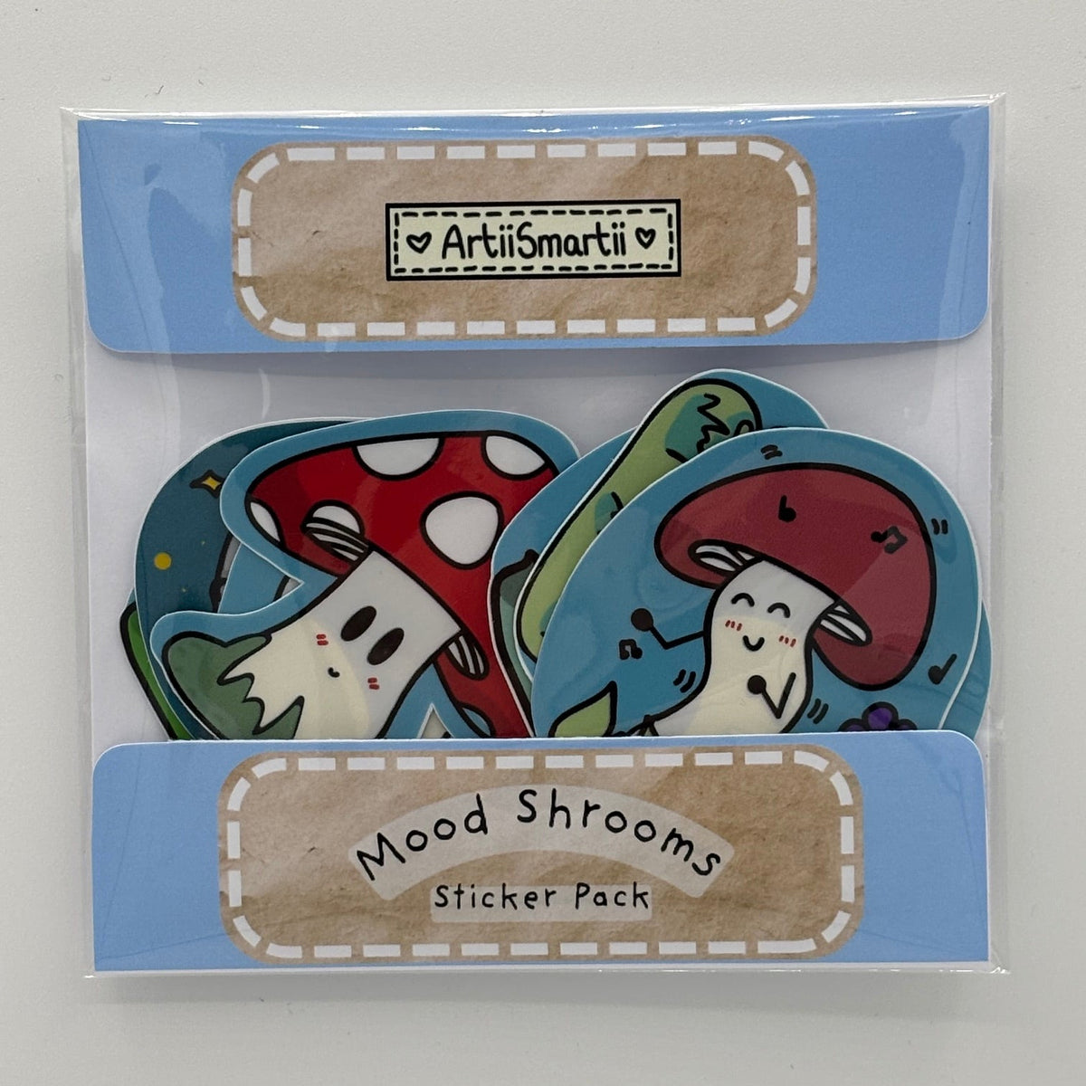 Pack of 10 individual sticker cartoon mushrooms with different moods. Packed in hand made packaging. Handdrawn designs. No A.I.